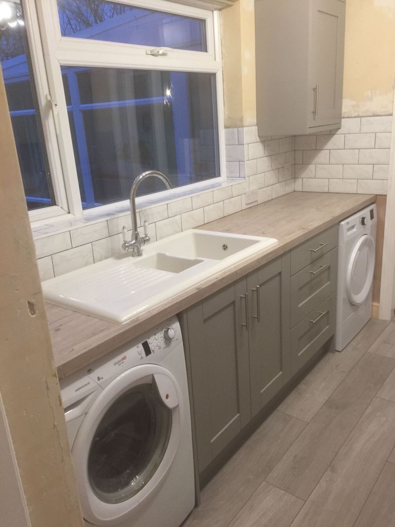 Homebase Timber Grey with Syllabub Laminate Worktop, White brick effect tiling & Manhattan grey grout.: Swipe To View More Images