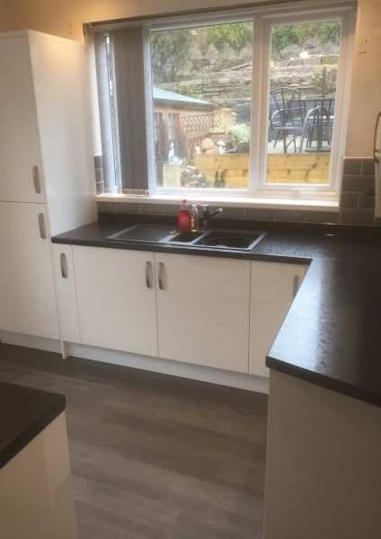 Homebase White Gloss Kitchen with Boss Bar Handles, Juno Black Composite Sink, Black Coffee Worktops & Upstands: Swipe To View More Images