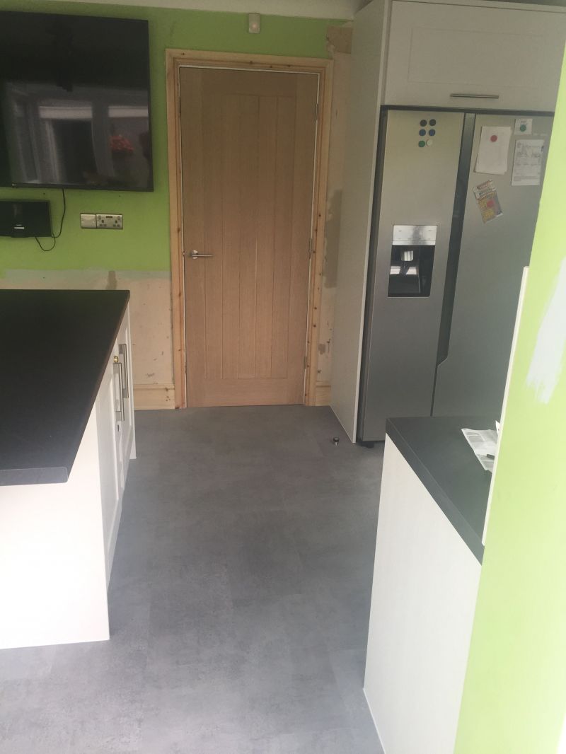 New door fitted with skirting, radiator and lighting.
Howdens Pumince Grey Vinyl Floor tiles.: Swipe To View More Images