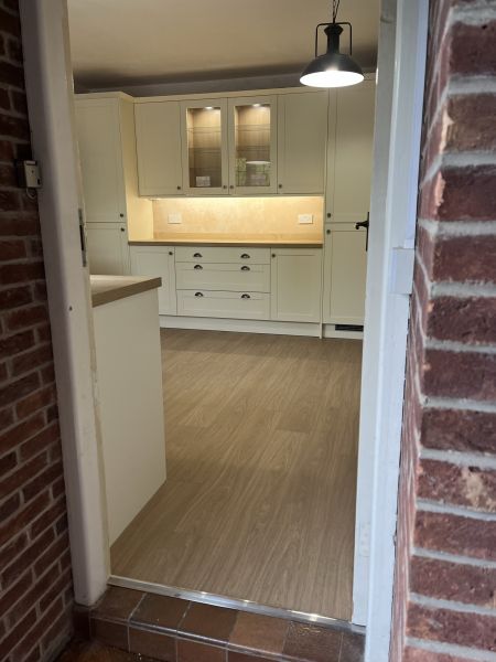 Howdens Allendale Antique White, classic profile, Courtier Antique pewter cup and round knob handles, Aged Oak Effect Square Edged Worktops.  Lamona products throughout.  Quick step Livyn Light Oak Vinyl flooring,: Swipe To View More Images