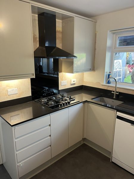 The complete package&excl;  Design&comma; Supply and Installation&period;  Howdens Clerkendwell Gloss Sandstone range with Quartz Liguiria Black Marble Worktops & Upstands&period;: Swipe To View More Images