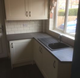 Classic Homebase Cream Kitchen with Ink Bark worktops, brick effect tiling & dark grey Lyvin Vinyl Flooring.: Click Here To View Larger Image