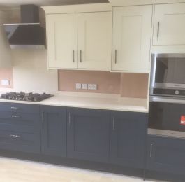 Artisan Peacock Blue Base units &  Buttermilk Wall units.  Miverva Caremel Crunch Worktops, upstands and splash back (Homebase range): Click Here To View Larger Image