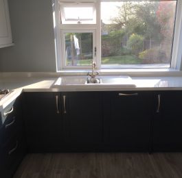 Homebase Navy Blue & Grey Shaker Style kitchen with White Sparkle Syllabub worktops and upstands.  Appliances were integrated.  Light Grey Vinyl flooring.: Click Here To View Larger Image
