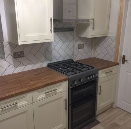Homebase French Cream range, Golden Oak worktop with metro tiles in Herringbone design throughout kitchen and utility area.: Click Here To View Larger Image