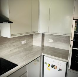 The full package&comma; Design&comma; Supply and Installation&period;  Howdens Clerkenwell Gloss Handless range in two tone Slate Grey & Dove Grey with Magma Concrete worktops and backboards&period;: Click Here To View Larger Image