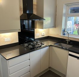 The complete package&excl;  Design&comma; Supply and Installation&period;  Howdens Clerkendwell Gloss Sandstone range with Quartz Liguiria Black Marble Worktops & Upstands&period;: Click Here To View Larger Image